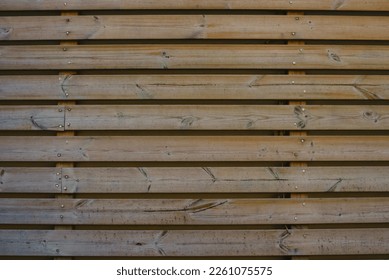 The texture of wooden horizontal boards on the wooden facade of the building - Shutterstock ID 2261075575