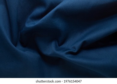 Texture of wrinkled, crumpled natural blue fabric close-up. the background for your mockup