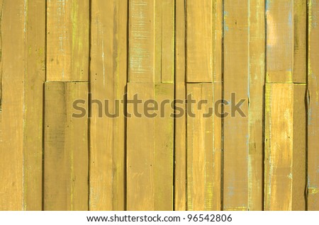 Texture of Yellow color paint plank wall for background