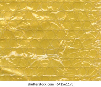 the texture of the yellow combined paper-teflon packaging material - Shutterstock ID 641561173