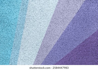 A textured abstract background featuring diagonal color stripes in shades of blue, lavender, and purple with a rough surface finish, creating a vibrant and artistic visual.
