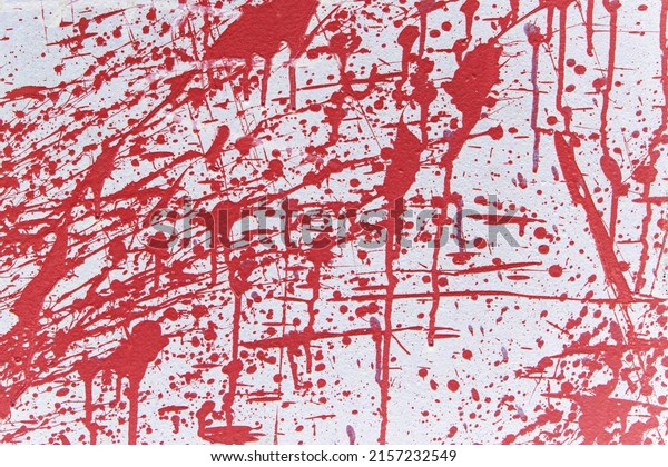 Textured abstract background with red splashes\
and gags. Grunge\
surface.