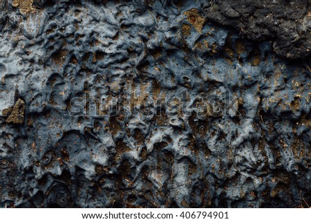 Textured alien heterogeneous surface, smooth gray stone with golden inclusions. Set rock drips texture closeup, unique background.