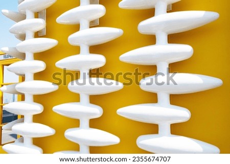 Textured background abstract white or grey plastic has a rough surface. Oval structure Embossed, same pattern, yellow background. attached to the House wall for background or website wallpaper.