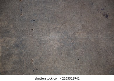 Textured background of brown concrete surface, with gunshot marks. Wooden surface. Light brown background. Texture of concrete fence. Traces of bullet wounds. Shots fired at the building. 