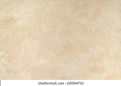 Textured background. Decorative plaster walls, external decoration of facade. Texture of beige. - Shutterstock ID 630504710