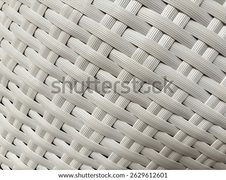 Textured background made of plastic that is carefully weaven and forms a comfortable chair
