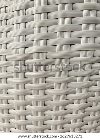 Textured background made of plastic that is carefully weaven and forms a comfortable chair