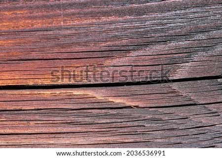 Textured background from old wooden exterior wall of a house close-up macro photography