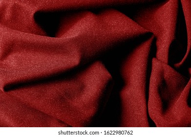 Textured, background, pattern, red cloth. Elegant knitted material with a high content of viscose. Elastic: suitable for your design. has an attractive appearance, is pleasant in work