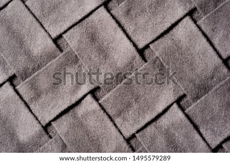 Textured, background, pattern, Woven fabric of intertwined folded strips of gray. Fashionable interior design, web pages, and other.