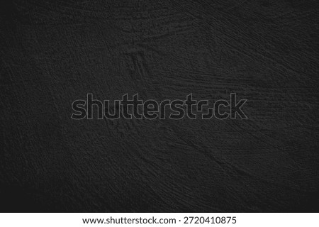 textured black surface with subtle linear patterns