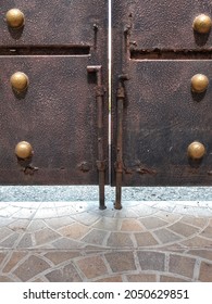  
Textured Black Wrought Iron Fence Gate With Drop Bolt Lock And Decorative Gold Circle.