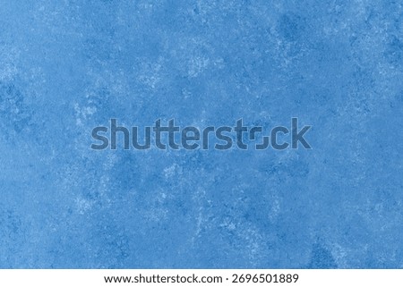 Textured blue plaster wall with soft cloud-like surface pattern