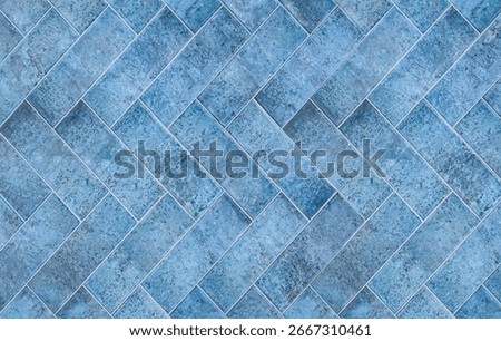 A textured blue tile with a classic pattern enhances home decor. Its versatile design suits various interior styles.