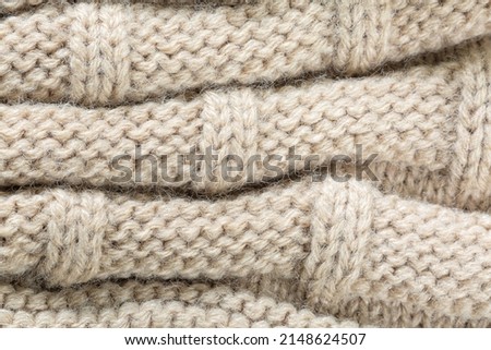 textured brown macro sweater,Seamless texture of handmade knitting of natural yarn. Sheep common wool. Knitted background. Closeup