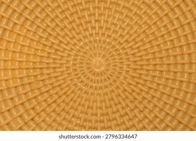 Textured brown pattern. Alternating radial and circular lines.
