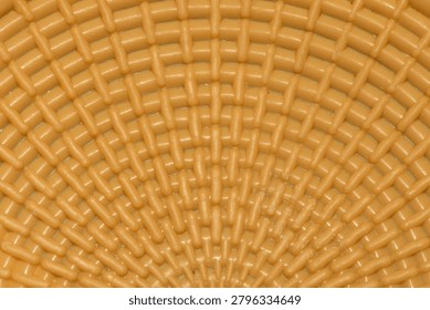 Textured brown pattern. Alternating radial and circular lines.