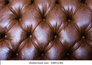 Textured Brown Tufted Leather With Floral Patterns