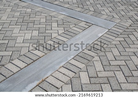Textured chevron background pattern herringbone brick tile floor walkway or patio