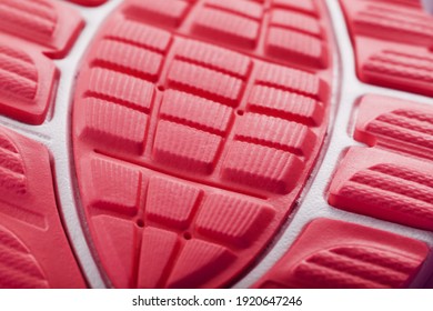 Textured Design Of The Sole Of The Sport Shoe In Red Macro. Close-up