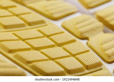 Textured Design Of The Sole Of The Tread Of A Sneaker In Yellow Macro. Close-up