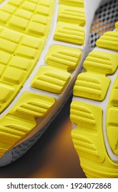 Textured Design Of The Sole Of The Tread Of A Sneaker In Yellow Macro. Close-up