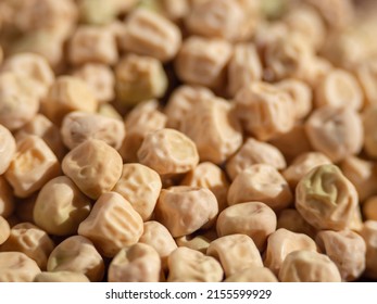 Textured Dry Seeds Of Green Peas Macro Photo, Shallow Depth Of Field. Yellow Pea Seeds. Dried Peas - Vegetable Light Texture Of Legumes For Background.