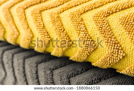 Textured fabric with a zigzag pattern in two colors. Color of the Year 2021. Illuminating Yellow and Ultimate Gray. 