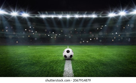 textured free soccer field in the evening light - center, midfield with the soccer ball - Shutterstock ID 2067914879