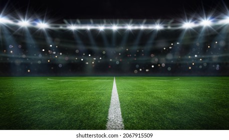 textured free soccer field in the evening light - center, midfield - Shutterstock ID 2067915509