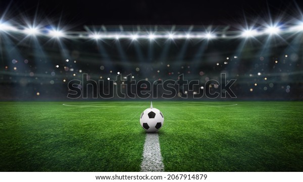 textured free soccer field in the evening\
light - center, midfield with the soccer\
ball