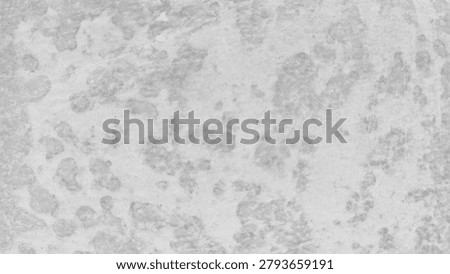 A textured gray concrete surface with irregular patterns and subtle variations, resembling a weathered or aged stone wall.