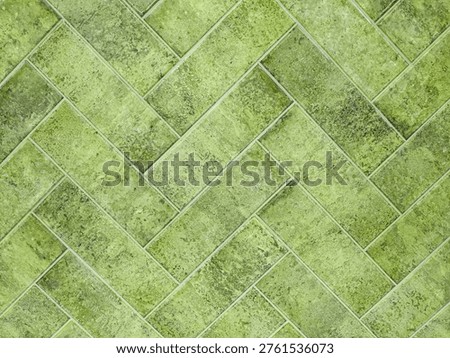 A textured Green tile with a classic pattern enhances home decor. Its versatile design suits various interior styles.