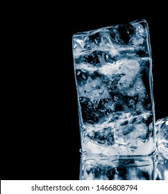 Textured Ice Block On Black Reflective Background.