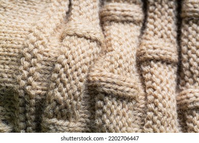 Textured Macro Brown Sweater,Seamless Texture Of Handmade Knitting Of Natural Yarn. Sheep Common Wool. Knitted Background. Closeup
