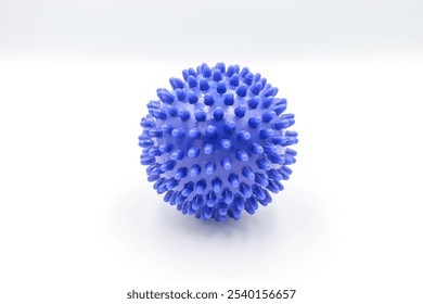 A textured massage ball designed for deep tissue relief and muscle relaxation, ideal for athletes and individuals seeking therapeutic pain relief, fitness, and wellness benefits - Powered by Shutterstock