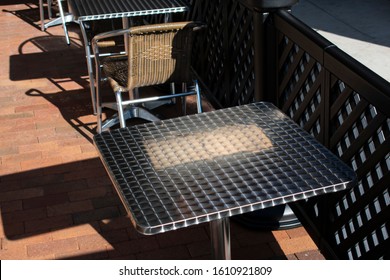 Textured Metal Outdoor Resturant Seating On Sunny Summer Day In Downtown Traverse City. 