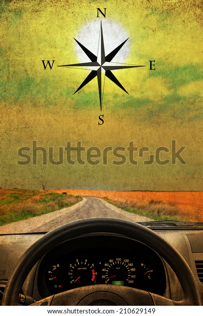 Textured old paper sunshine\
background with wind rose, wheel and dashboard of a car.  Retro\
style image 