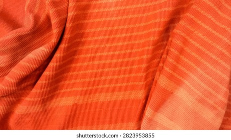 textured orange textile with fine pattern and smooth background bend