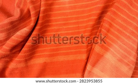 textured orange textile with fine pattern and smooth background bend