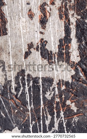 Textured paint surface with peeling layers and scratches. Green and black colours in rugged interplay.