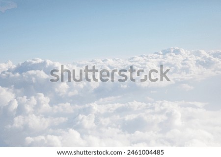 textured pattern of clouds in the stratosphere, visible from an airplane window. summer nature backgrounds