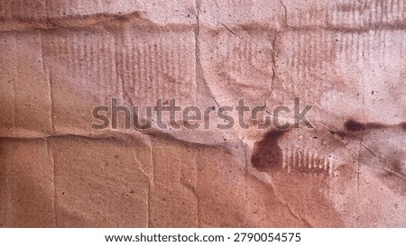 Textured pink and beige wall with subtle vertical lines