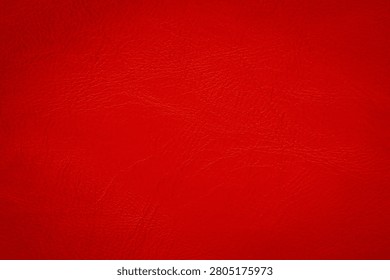 Textured red surface with a subtle grain pattern.