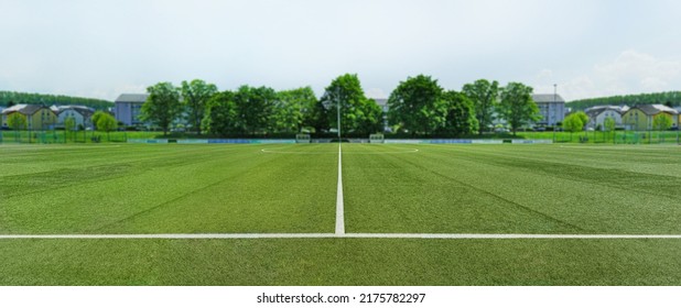 textured soccer game field in a small town. - center, midfield - Powered by Shutterstock