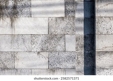 Textured stone wall with subtle shadows and weathered surface. - Powered by Shutterstock - Get 15% off with code: PIKWIZARD15
