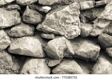 the textured surface of an ancient stone wall for backgrounds and for wallpaper - Shutterstock ID 775385731