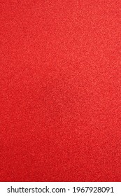 Textured Surface Red Paper With Sparkles, Defocused. Abstract Holiday Shiny Background, Design Element.