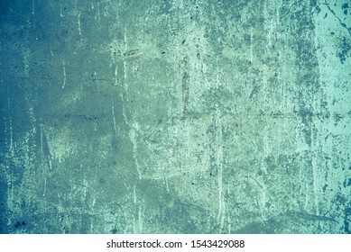 Textured vintage stripped blue wall. Background of concrete neon tones in grunge style. The view from the top. The surface of the shooting table lay flat. Copy space